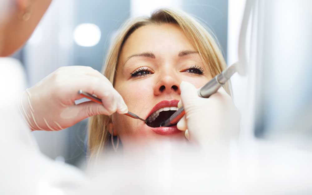 Dentist Near Me Totowa NJ 51 root canal procedure showing careful cleaning and shaping of infected tooth roots to relieve pain and save the natural tooth